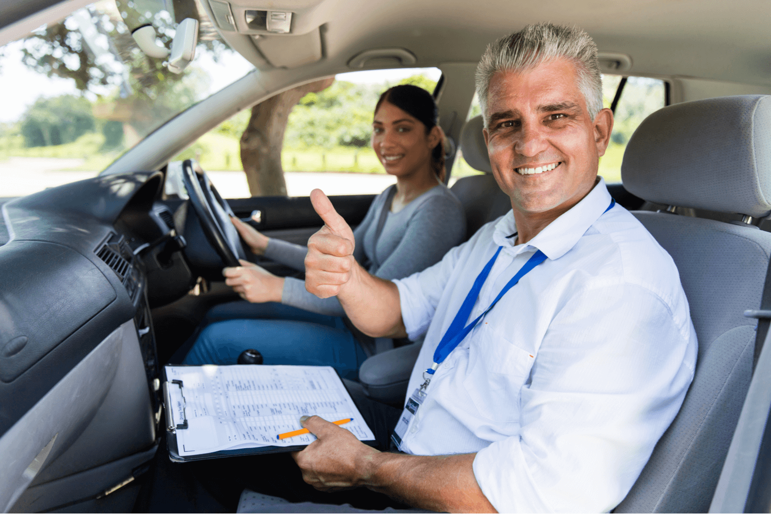 WE – Over 20 Driving Instruction (1) Driving instructor teaching a new US Immigrant how to drive