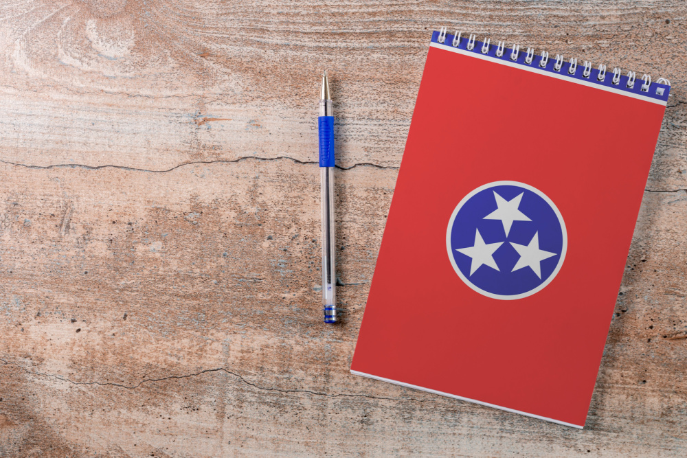Educational needs of notebook and pen with the Tennessee flag