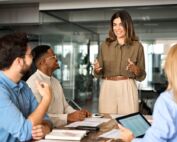 A woman leads a team discussion