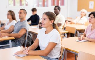 A group of adults in a classroom.