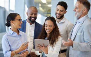 Diverse group of business professionals collaborating with a mentor in an office